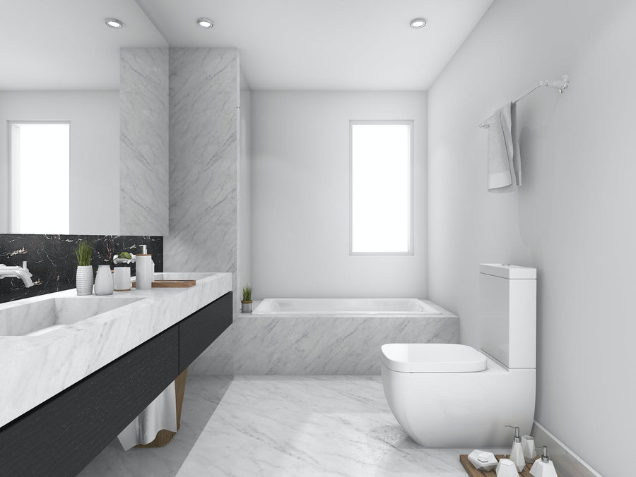 Modern bathroom with a white ceiling and marble countertops