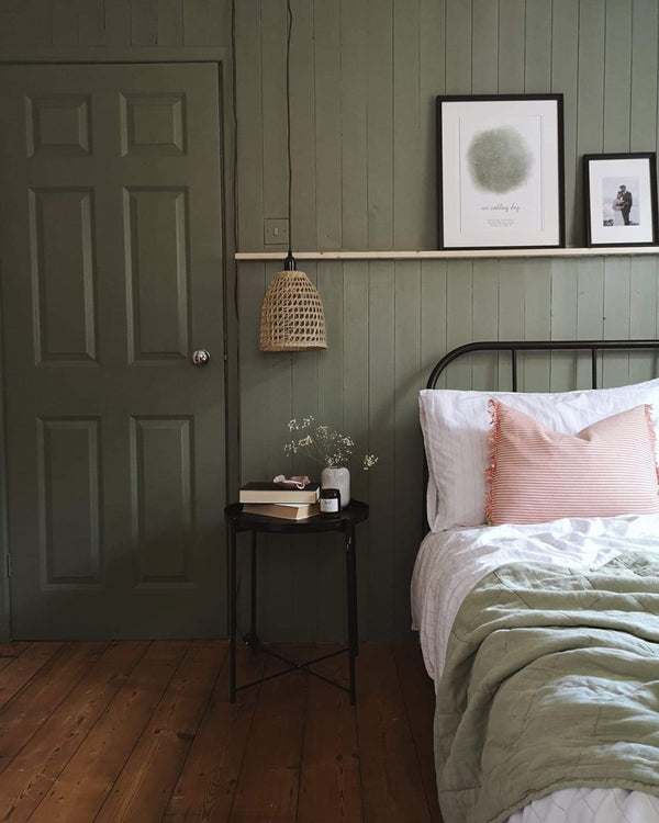 A bedroom with shiplap cladding painted in Lick Green 02 paint